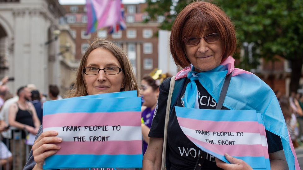 A woman holding a sign